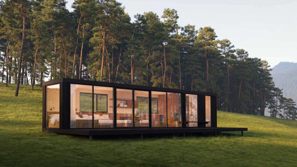 Dom Rewild z widokiem na góry, ekologiczna architektura z drewna i szkła, otoczona naturą.